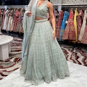 Elegant Pastel Green Lehenga with Iridescent Details
